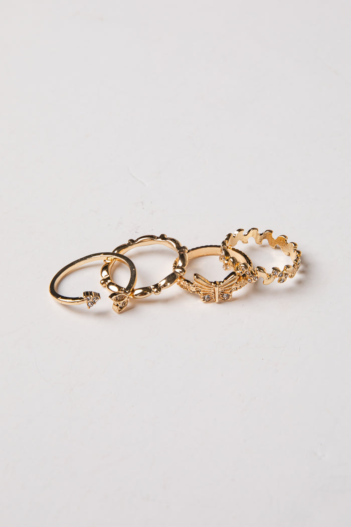 Set of gold hoop earrings on a light gray background