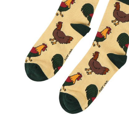 Pair of socks with chicken pattern on a white background