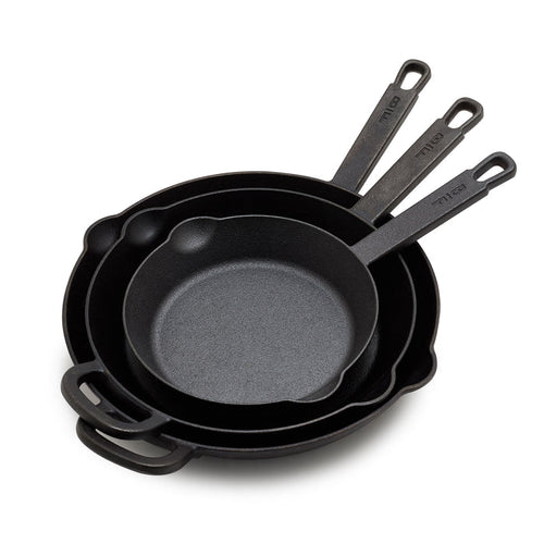 The Bobby Flay by GreenPan 8", 10" and 12" Cast Iron Frypan Set includes three nested pans, each with a roomy cooking surface and long handle with a hanging hole—heirloom-quality cast iron skillets made for everyday use.