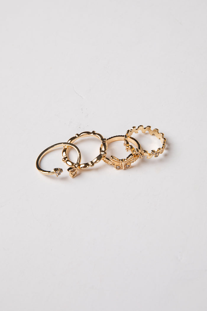 Set of gold hoop earrings on a light gray background