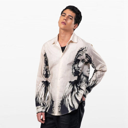 Man wearing the white and grey CM resort shirt, front view with monochrome portrait print, hand on hip