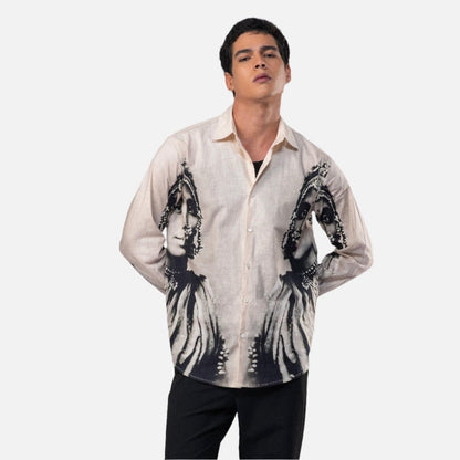 Man wearing the CM resort shirt with black trousers, front view, hands behind his back