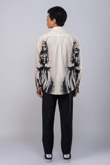 Man wearing the CM resort shirt with black trousers, full length back view showing the portrait print