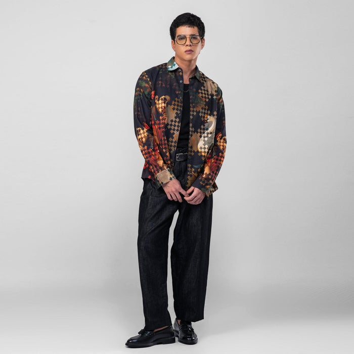 Man wearing the Damayanti's Secret shirt with black trousers, full length three-quarter view, hands low