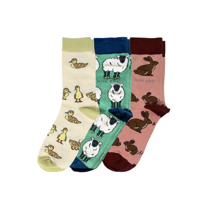 Three pairs of socks with animal patterns on a white background