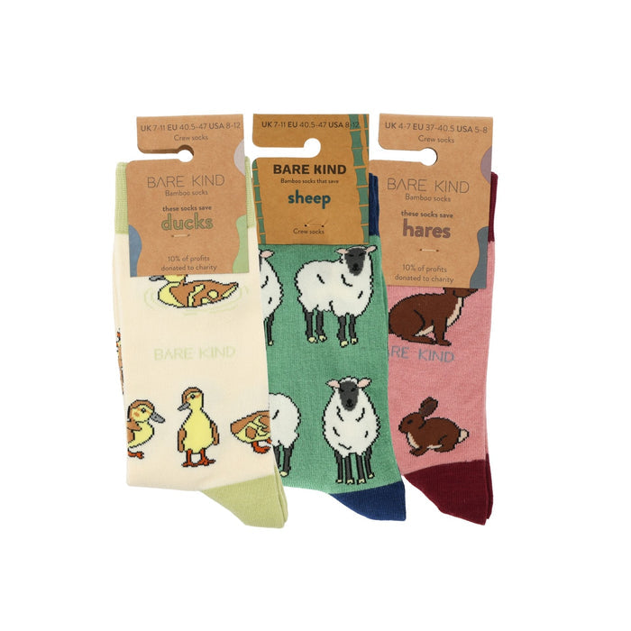 Three pairs of socks with animal illustrations and 'Bare Kind' branding on a white background.