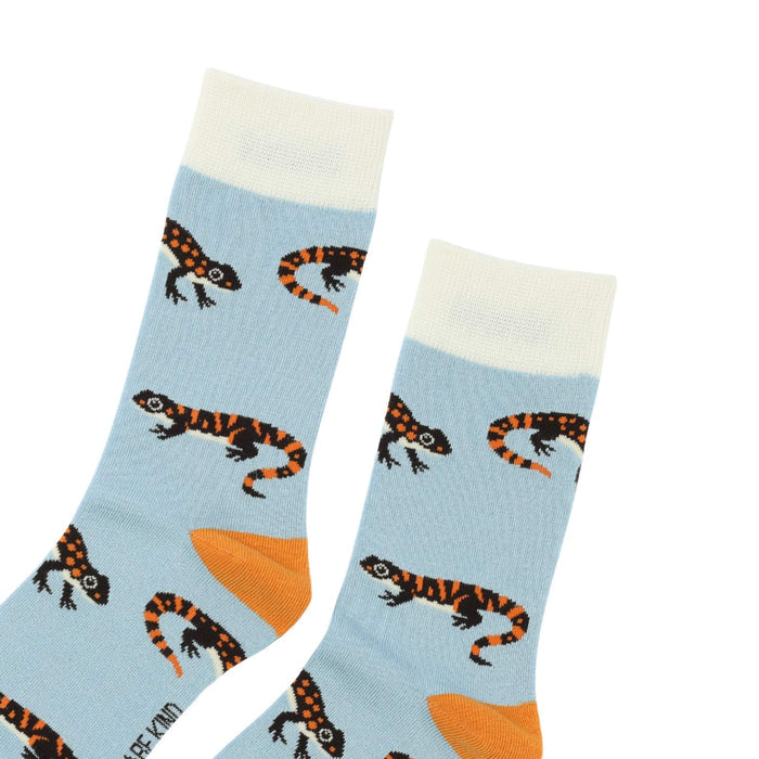 Pair of socks with salamander pattern on a light blue background