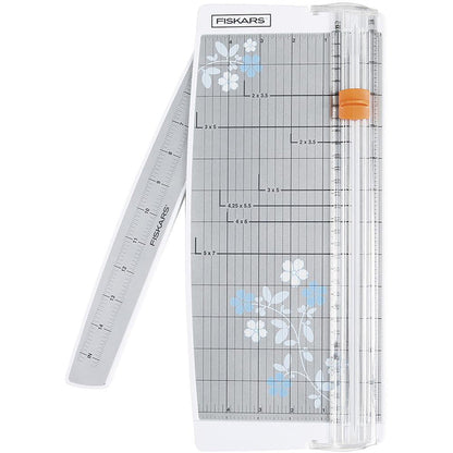 FISKARS-Euro Paper Trimmer. This trimmer features the triple track blade and rail system, a swing-out arm that extends the measuring deck to 15 inches, an ergonomic carriage for a better grip while cutting, and rubberized feet for stability. Available at Embellish Away located in Bowmanville Ontario Canada.