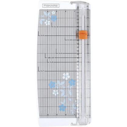 FISKARS-Euro Paper Trimmer. This trimmer features the triple track blade and rail system, a swing-out arm that extends the measuring deck to 15 inches, an ergonomic carriage for a better grip while cutting, and rubberized feet for stability. Available at Embellish Away located in Bowmanville Ontario Canada.