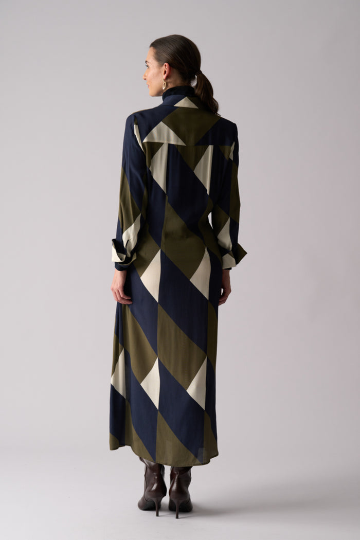 Back view of model wearing Foil FO8501 Maximum Impact Dress Mod Geo. Shop Foil at Dotique