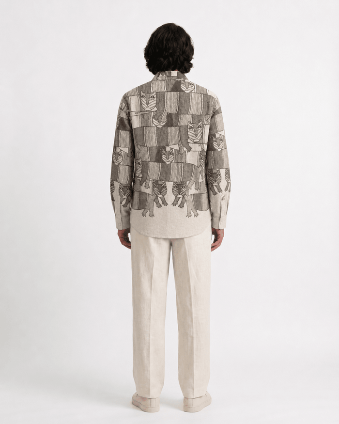 Man wearing the Gond Forest shirt, back view