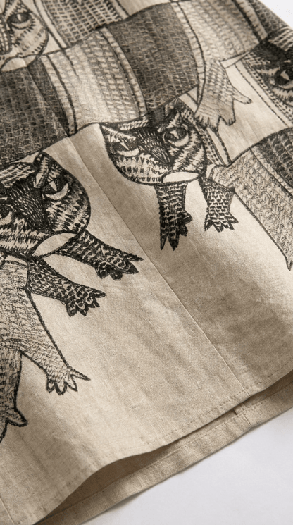 Close view of the Gond Forest shirt hem showing the Gond art animal motifs