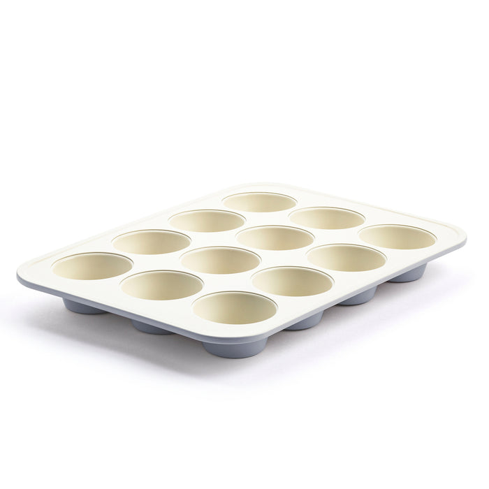 Ceramic muffin pan in quartz gray with 12 cups, shown on a white background.