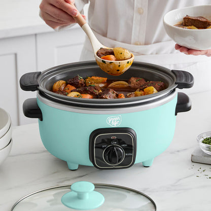 Turquoise slow cooker with food being served from it on a kitchen counter.