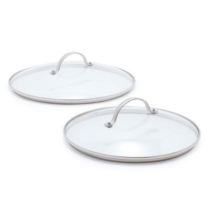 Two glass lids with stainless steel handles on a white background