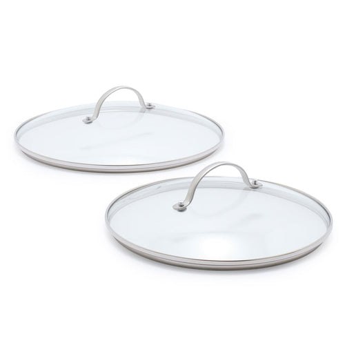 Two glass lids with stainless steel handles on a white background