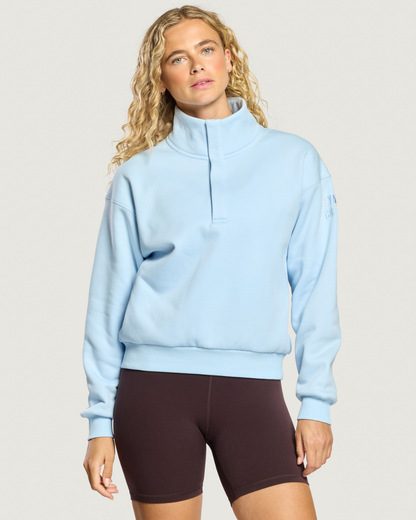 Woman wearing Gym+Coffee Daily Snap Collar Sierra Sweatshirt Glacial Blue Shop Gym+Coffee at Dotique