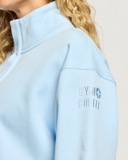Close up of Gym+Coffee Daily Snap Collar Sierra Sweatshirt Glacial Blue sleeve Shop Gym+Coffee at Dotique