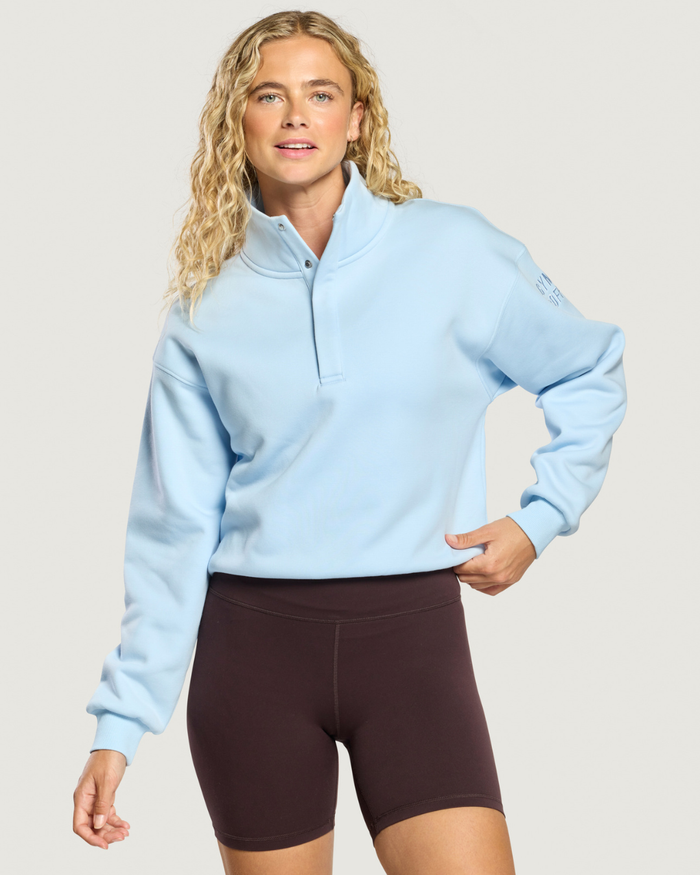 Woman wearing Gym+Coffee Daily Snap Collar Sierra Sweatshirt Glacial Blue Shop Gym+Coffee at Dotique