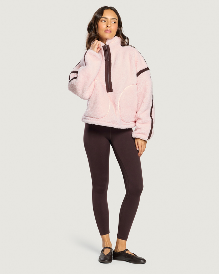Gym+Coffee Industry Fleece Half Zip Ballet Pink worn by woman Shop Gym+Coffee at Dotique
