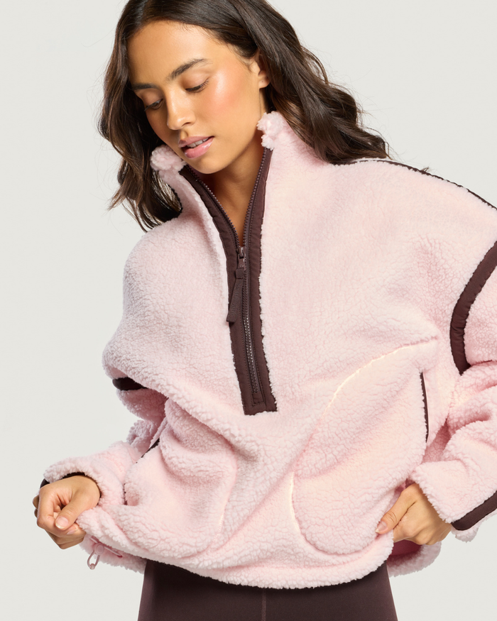 Woman wearing Gym+Coffee Industry Fleece Half Zip Ballet Pink Shop Gym+Coffee at Dotique