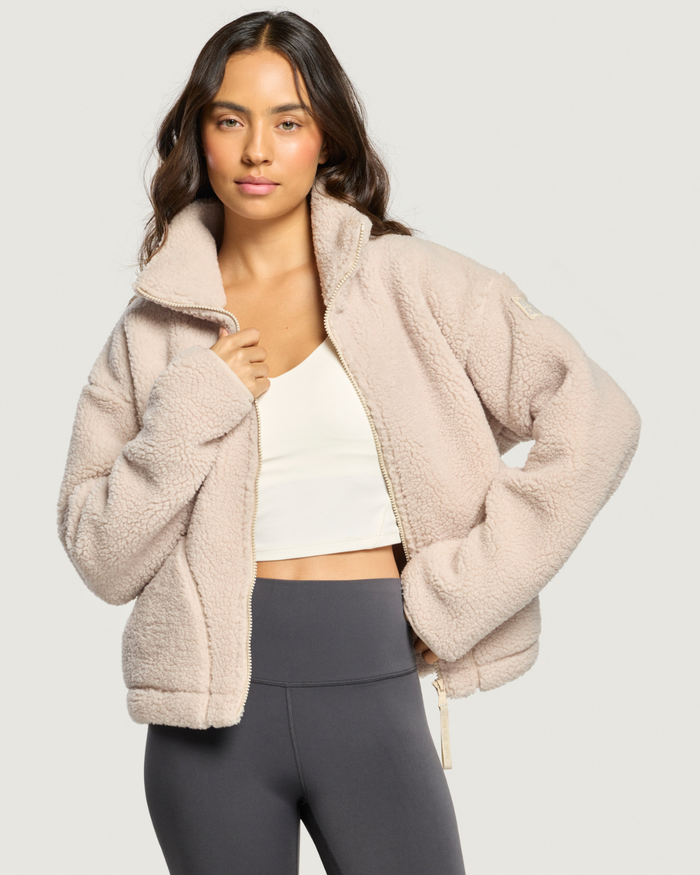 Woman wearing Gym+Coffee Industry Fleece High Collar Jacket Natural Shop Gym+Coffee at Dotique