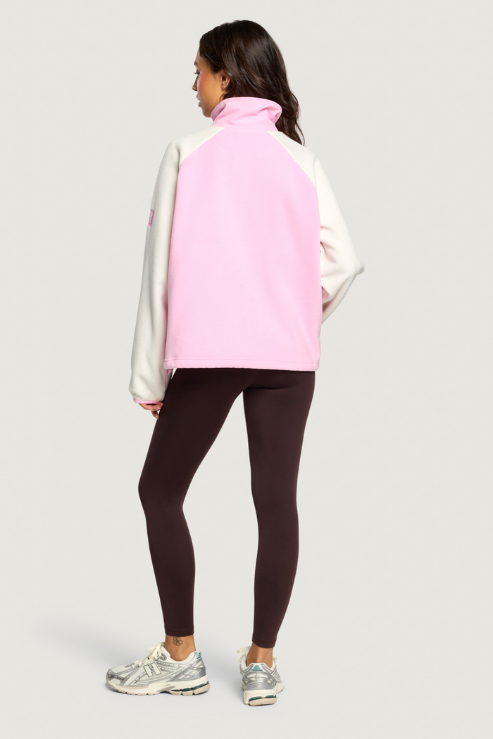 Back view of model wearing Gym+Coffee Snap Polar Fleece Pink Blossom Shop Gym+Coffee at Dotique