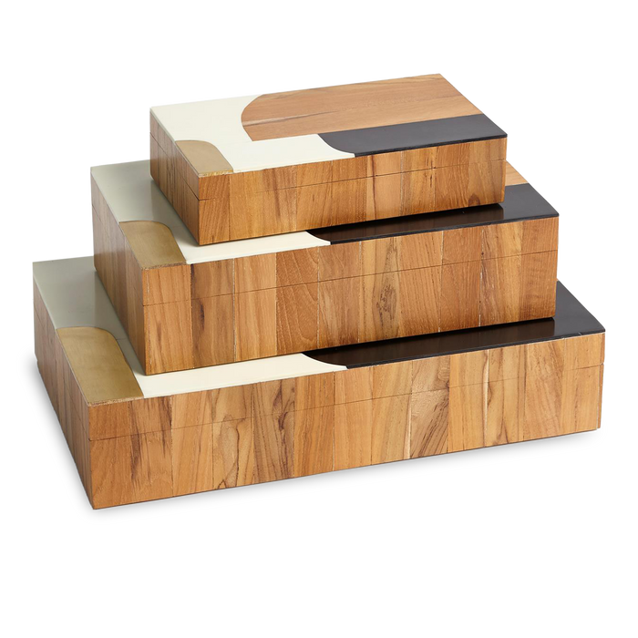 Teak wood, resin and brass join forces to create these abstract boxes.