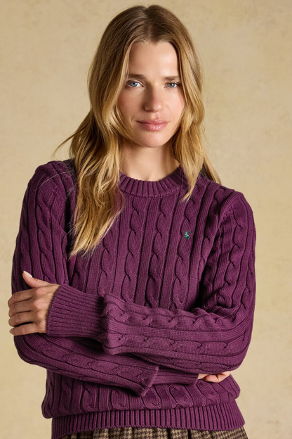Shop the Joules Classic Cable Jumper in Wine at Dotique. A 100% cotton cable knit with a crew neck, ribbed trims and signature Joules hare embroidery.