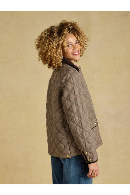 Smiling model wearing Joules Harrogate Check Coat Shop Joules at Dotique