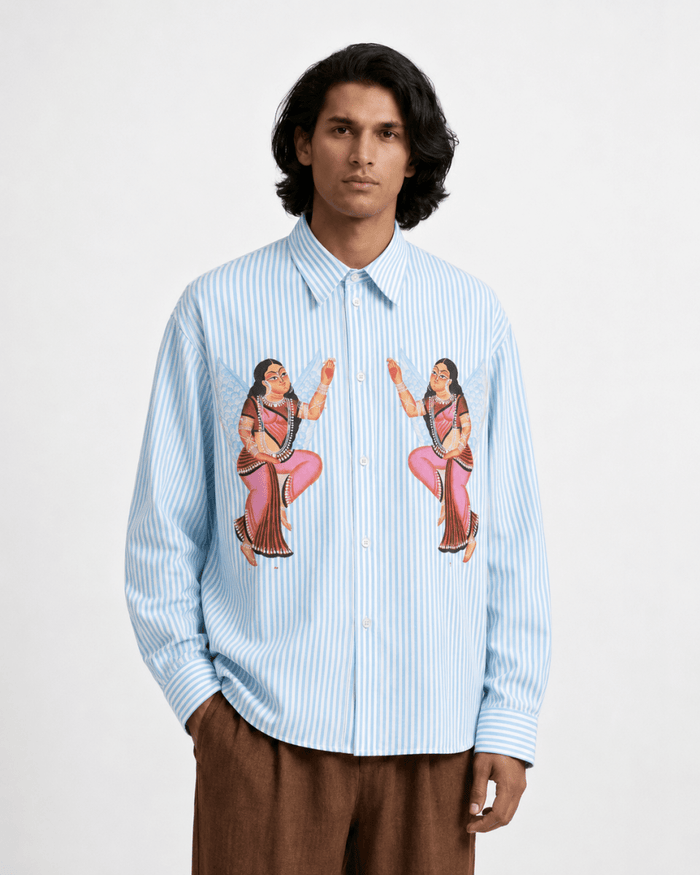 Man wearing the blue striped Kalighat Graffiti shirt, front view, hand in pocket
