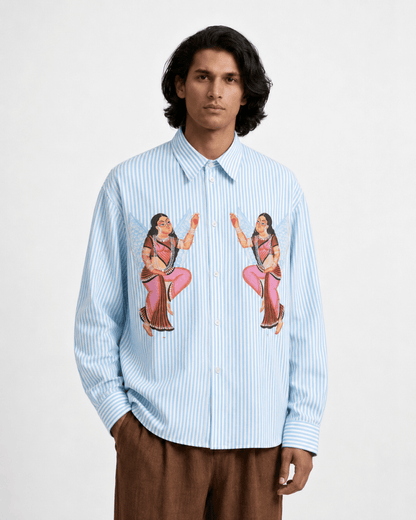 Man wearing the blue striped Kalighat Graffiti shirt, front view, hand in pocket