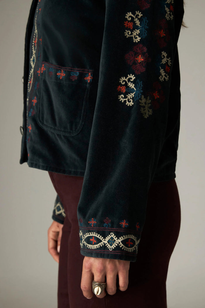 Shop the Maison Hotel Breton Jacket in Jade at Dotique. A cotton velvet jacket with colourful embroidered trims, button front and patch pockets.