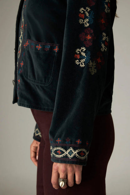 Shop the Maison Hotel Breton Jacket in Jade at Dotique. A cotton velvet jacket with colourful embroidered trims, button front and patch pockets.