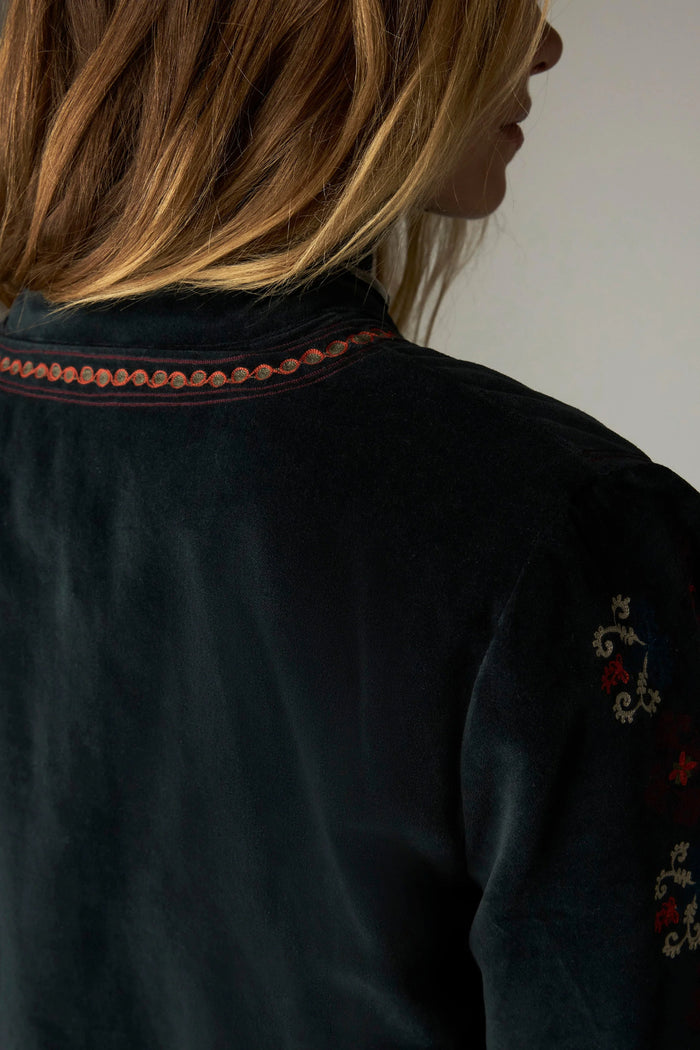 Shop the Maison Hotel Breton Jacket in Jade at Dotique. A cotton velvet jacket with colourful embroidered trims, button front and patch pockets.