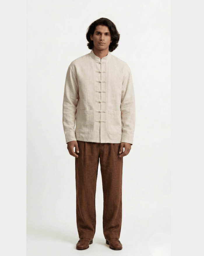 Man wearing the off white Mandarin collar shirt with frog buttons, front view
