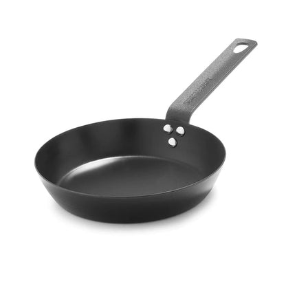 Black carbon steel 8-inch frypan with a metal handle on a white background.