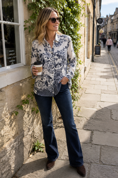 Milano 63-6557-3655 Navy Floral Print Shirt Blouse worn by a model. MILANO. Shop MILANO at Dotique