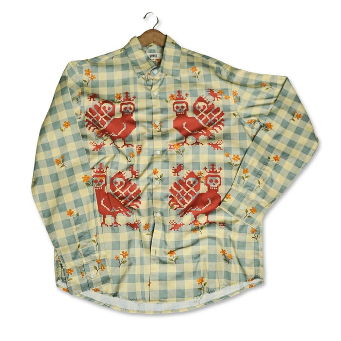 Mori Checks shirt for men in green check, front view laid out with creases, showing the red bird motifs