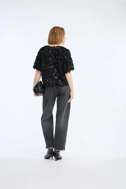 MUNTHE Valence Sequin & Fringe Top – Black shown from behind on model. Shop Munthe at Dotique