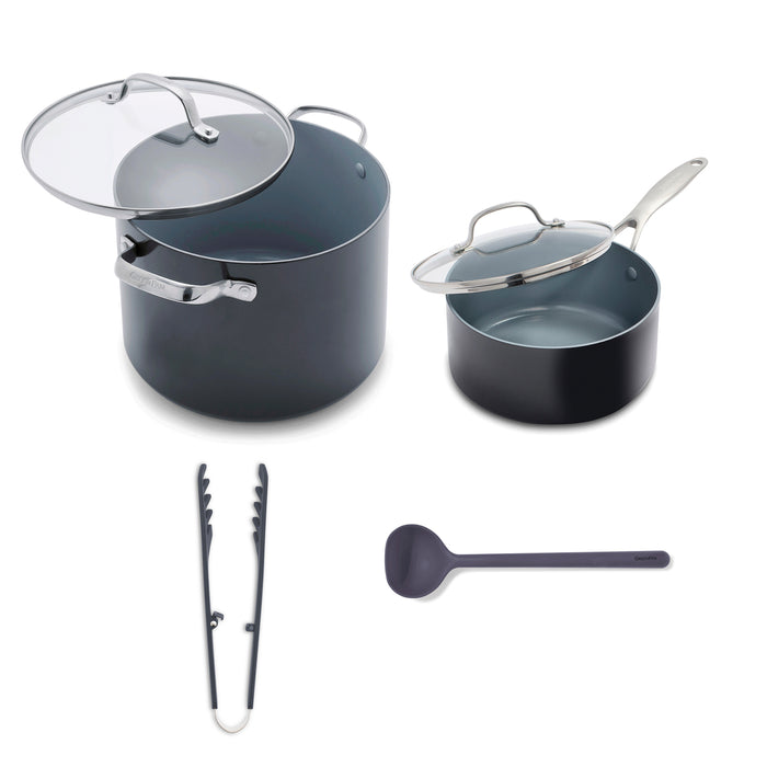 Set of gray cookware with lids, tongs, and ladle on a white background