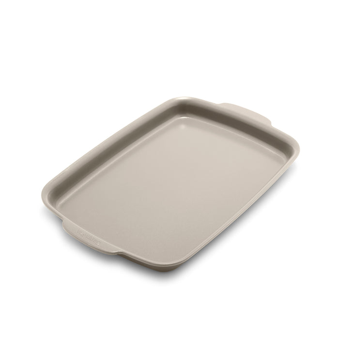 Taupe ceramic nonstick quarter sheet pan with raised edges and a side handle, 13 by 9 inches.