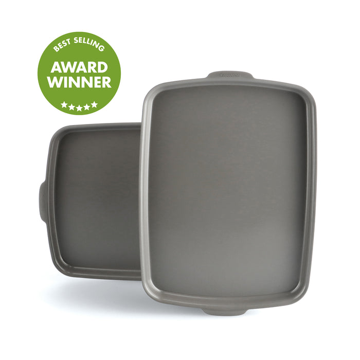 Two overlapping ceramic nonstick sheet pans, 13x9, shown next to a green Best Selling Award Winner badge.