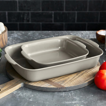 Two taupe ceramic nonstick cake pans, 2-piece set, shown nested together.