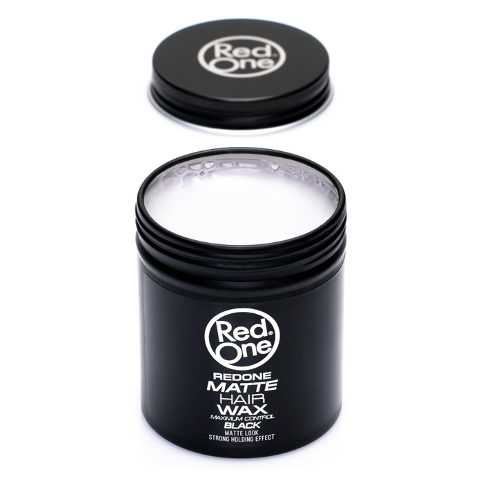 Open jar of Red One Matte Hair Wax Black 100ml with the lid removed, revealing the white matte styling wax. Maximum control formula provides a strong hold with a natural matte finish for all hair types.