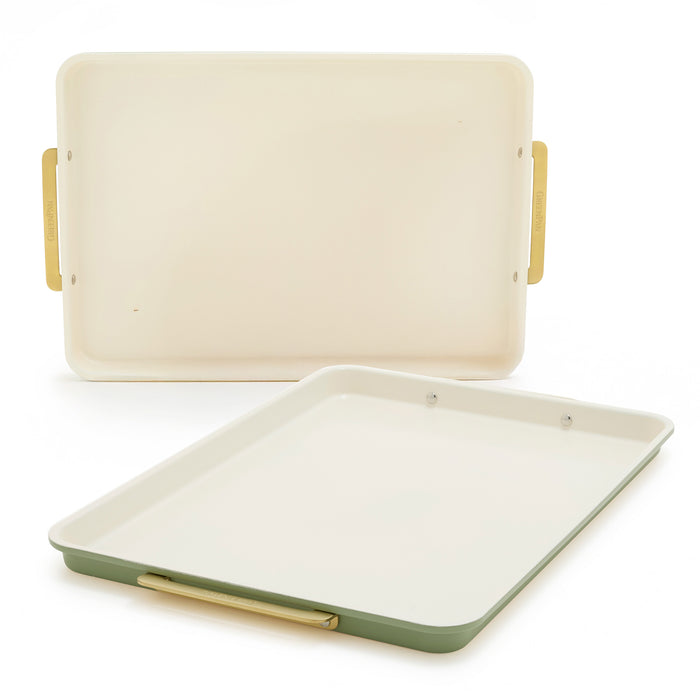Two sage green half sheet pans with cream interiors and gold handles, set of two, shown on a white background.