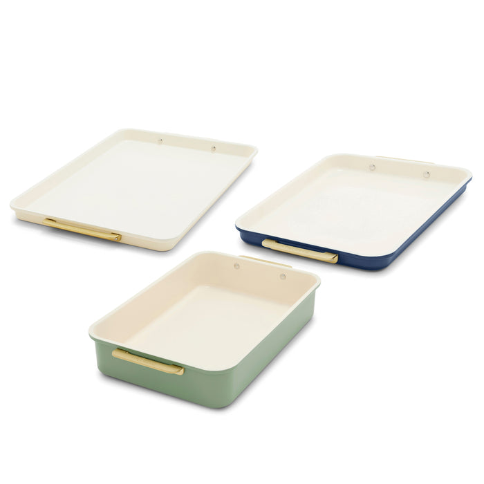 3-piece bakeware set in cream, navy blue, and green with gold handles on a white background.