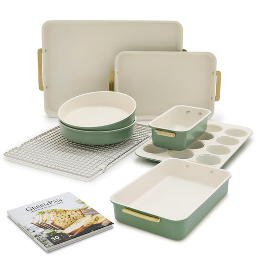 Sage green 8-piece bakeware set with aluminized steel pans, baking sheets, cooling rack, muffin tin, and recipe booklet.