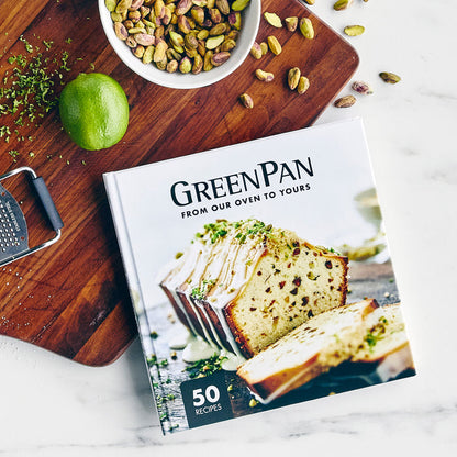 Gray ceramic nonstick 5-piece ovenware set on a table with a lime, zest, pistachios, and a grater.