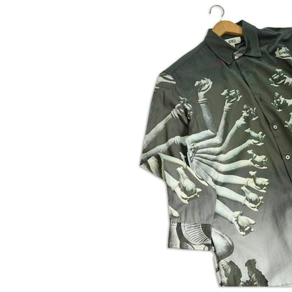 Partial view of the SB Sahasrabahu shirt on a hanger, showing the Hevajra arms artwork on the chest